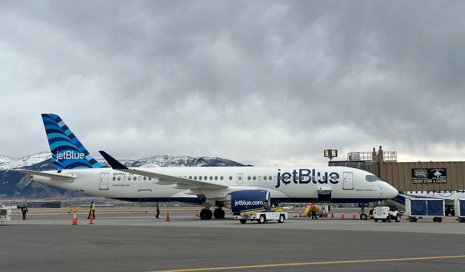 JetBlue aircraft parked at gate 